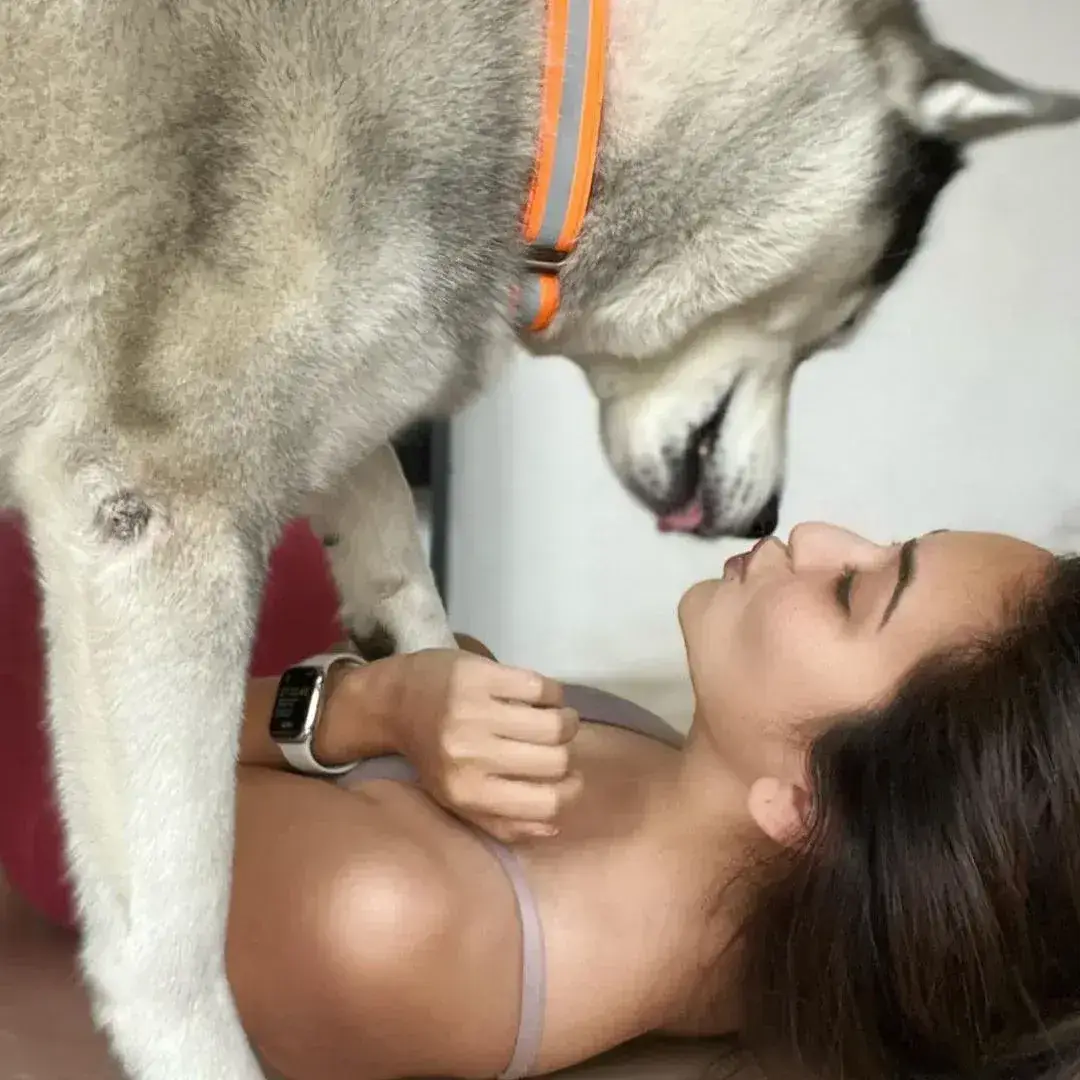 MODEL KRITI KHARBANDA PLAYING WITH HER PET DOG FUN IMAGES